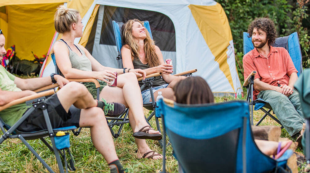 Friends making a camp meal on the Eureka! SPRK+ Stove 