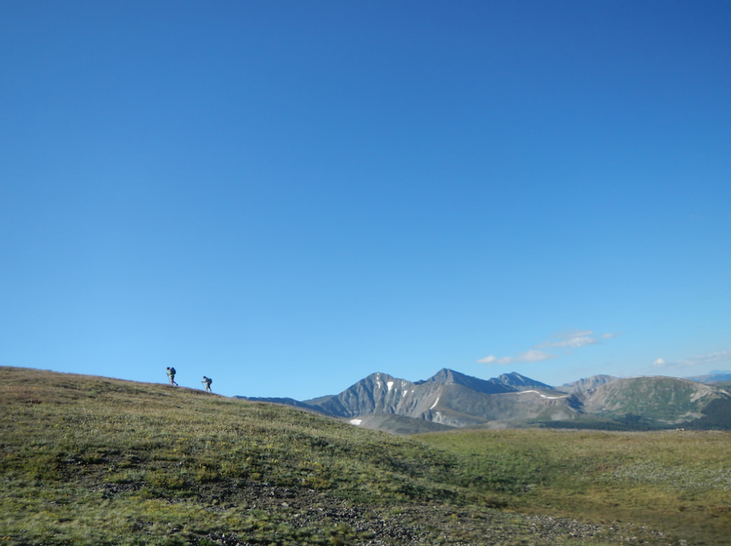 The Colorado Trail below Peak 6 with Crystal Peak and Pacific Peak on the horizon.
    James Dziezynski