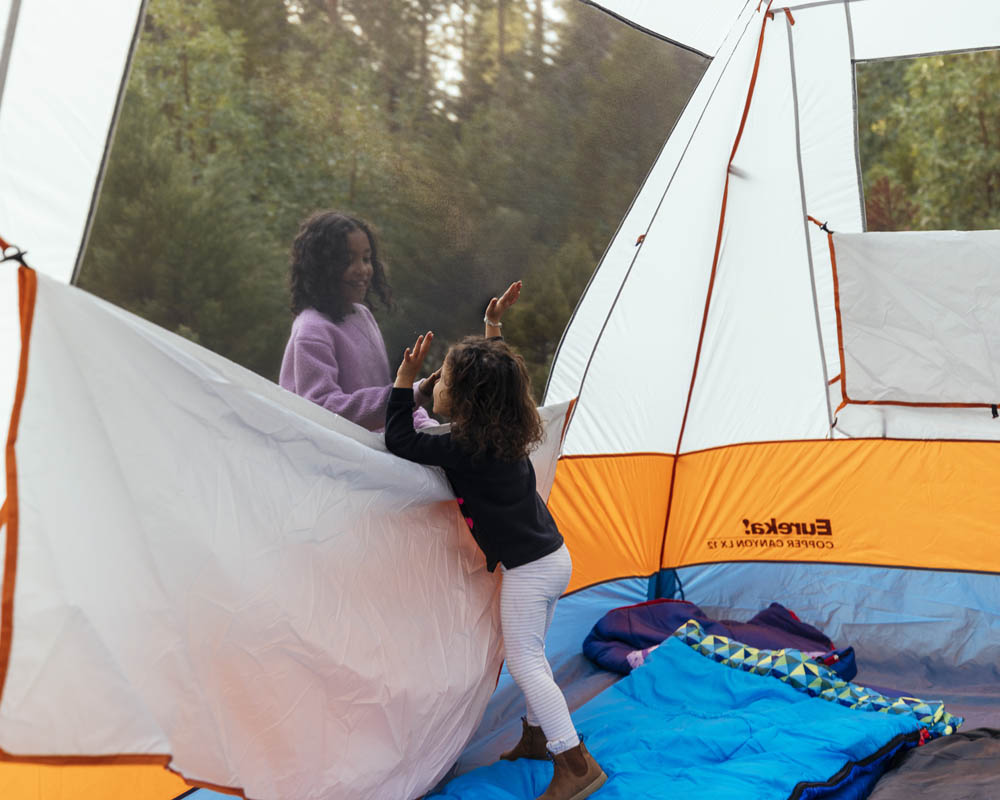Kids playing inside of the Eureka Copper Canyon LX 12 camp tent
