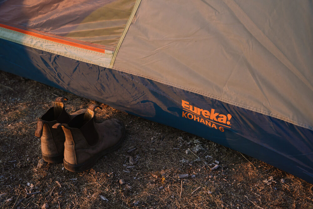 Warm camp boots outside the Eureka Kohana 6 tent