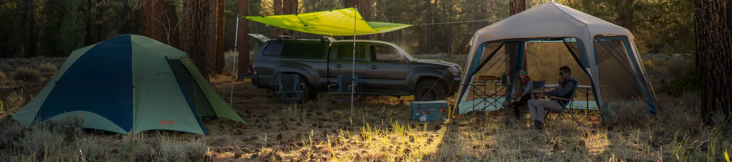 Couple at campsite with Eureka! Tent products